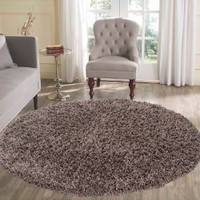 plain shaggy taupe rug circle in living room