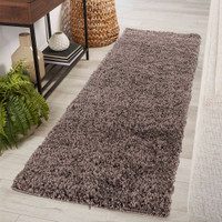 plain shaggy taupe rug runner in hallway