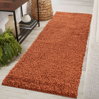 plain shaggy terracotta rug runner in a hallway