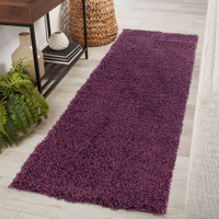 plain shaggy violet rug runner in hallway