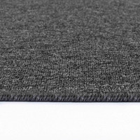 plain low pile dark grey rug runner closeup edge on white floor