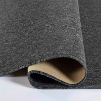 plain low pile dark grey rug runner folded on white floor