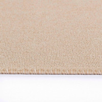 plain low pile light beige rug closeup edge on white floor