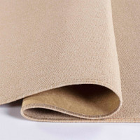 plain low pile light beige rug folded on white floor