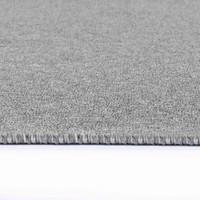plain low pile silver rug closeup edge on white floor