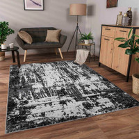 modern abstract abrasion black rug in a living room