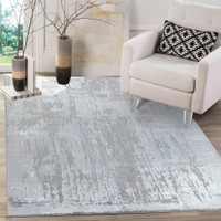 modern abstract abrasion grey rug in a living room