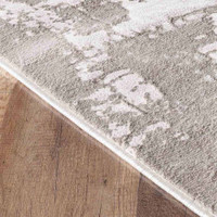 modern abstract acrylic stone rug runner closeup edge on wooden floor