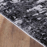 modern abstract lines black rug closeup edge on wooden floor