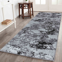 modern abstract sprayed black rug runner in a hallway