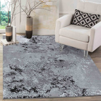 modern abstract sprayed black rug in a living room
