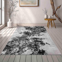 modern abstract sprayed black rug in a living room