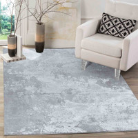 modern abstract sprayed grey rug in a living room