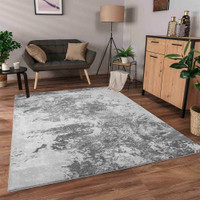 modern abstract sprayed grey rug in a living room