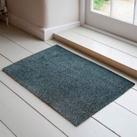 silver dirt trapper doormat in a doorway