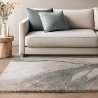 abstract blue shaggy rug in a living room with cream sofa