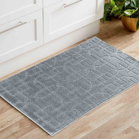 cubed trellis silver doormat in a living room