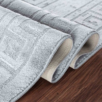 greek key dark grey doormat folded on wooden floor