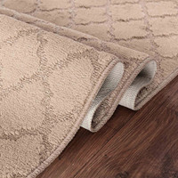 trellis beige doormat folded on wooden floor