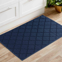 trellis navy doormat in a living room