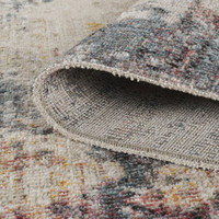 abstract multi-colour rug rolled