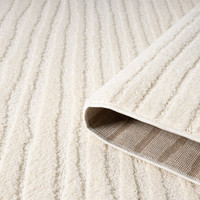 rena cream rug runner partially rolled