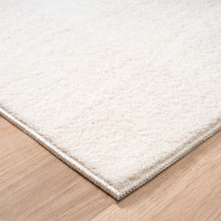 plain white rug side view of corner