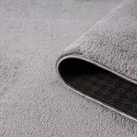 plain grey rug runner partially rolled