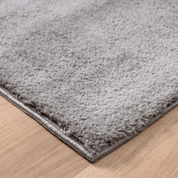 plain grey rug side view of corner