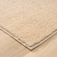 plain beige rug runner side view of corner