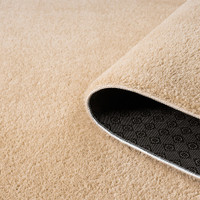 plain beige rug runner partially rolled