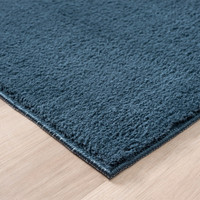 plain navy rug side view of corner