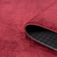 plain red rug runner partially rolled