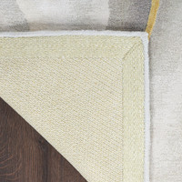 grey charcoal abstract rug closeup of corner folded