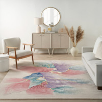 ivory floral rug in a living room with furniture