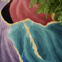 black abstract rug closeup pattern with a plant