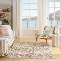 floral sage rose rug indoors with seaside view