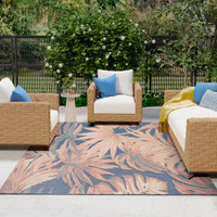 floral blue rose rug outdoors with furniture and plants