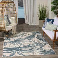 floral ivory blue rug indoors dark setting