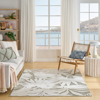 floral ivory sage rug indoors with seaside view