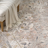 ivory traditional rug closeup pattern with chair