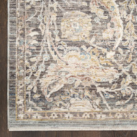 charcoal traditional rug closeup corner on a dark wood floor