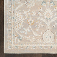 light grey traditional rug closeup corner with dark wood floor