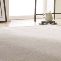 cream beige modern rug closeup living room with white decor