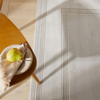 grey beige modern rug closeup with table