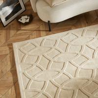 ivory wool rug closeup corner on wood floor