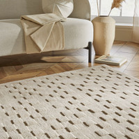 taupe wool rug in a living room with natural decor