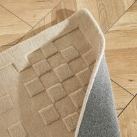 taupe wool rug closeup folded