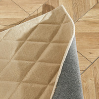 beige wool rug closeup folded
