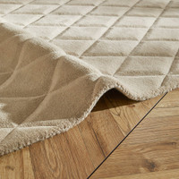 ivory wool rug closeup fold